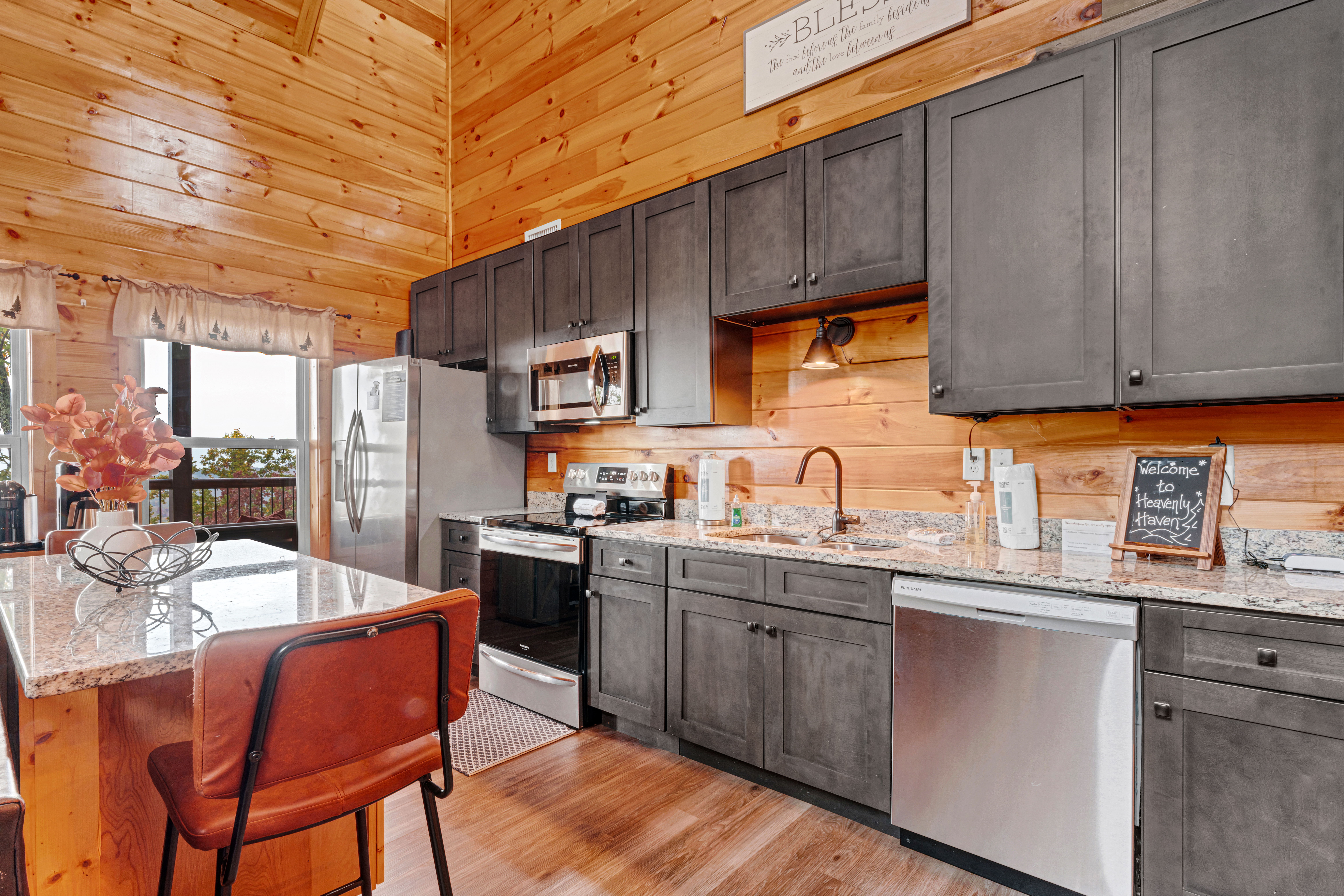 Kitchen island close-up showing stone countertop and bar seating.